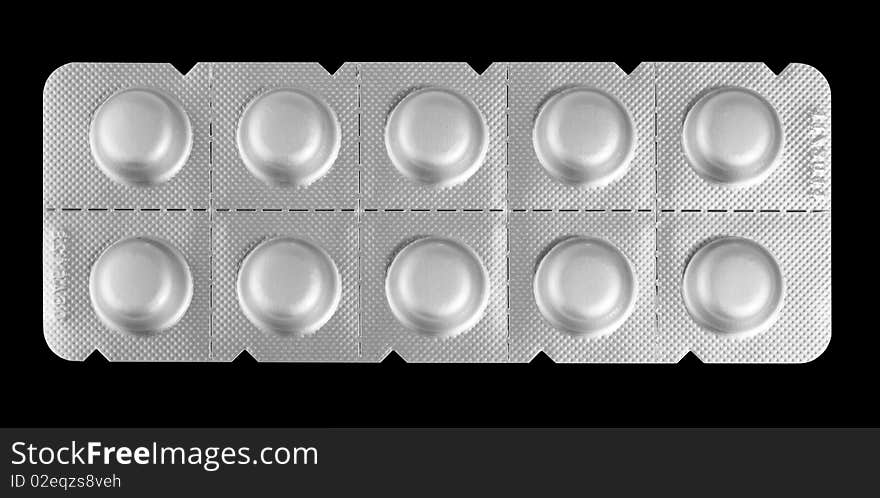 Close-up medicaments pills isolated on black background. Close-up medicaments pills isolated on black background.