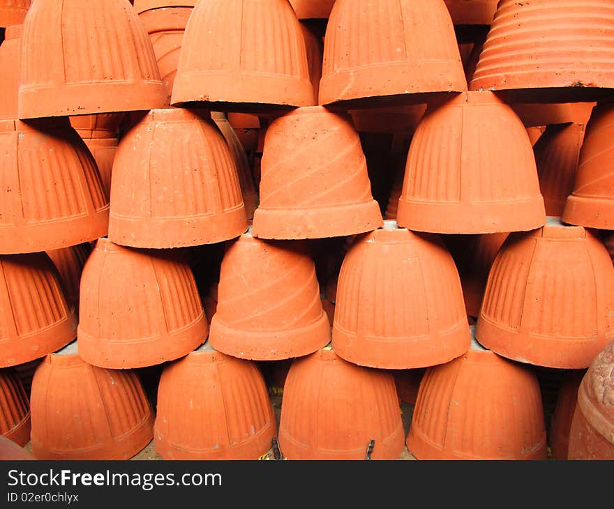 Brown color clay pots for sale at potter's shop.