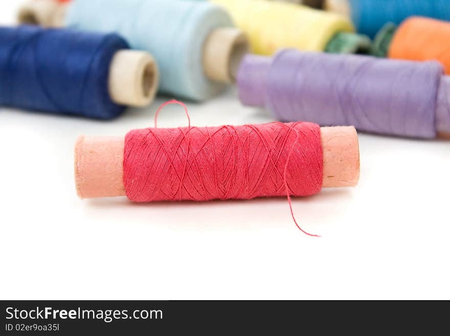 Multicolor thread reels on white