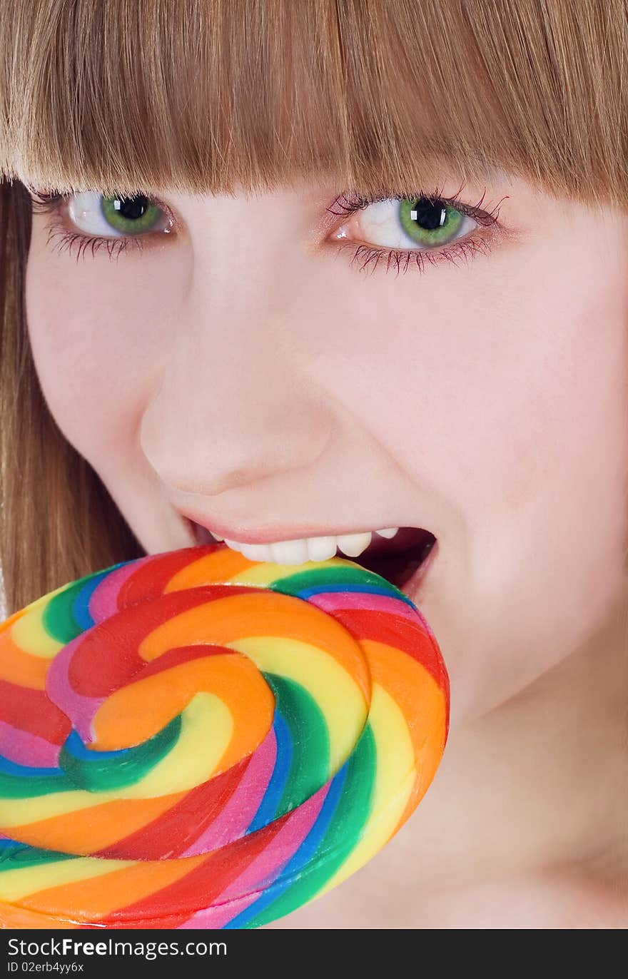 Picture of hungry blondie with color lollipop. Picture of hungry blondie with color lollipop