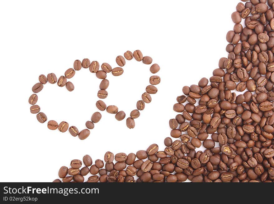 Two coffee heart on white background (close up). Two coffee heart on white background (close up)