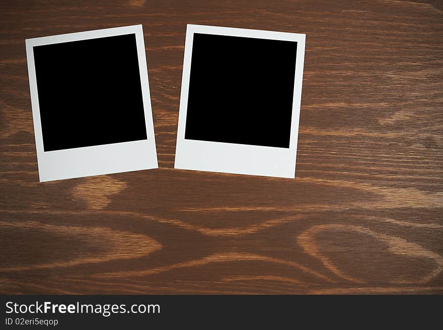 Polaroid film blanks on a wooden background background