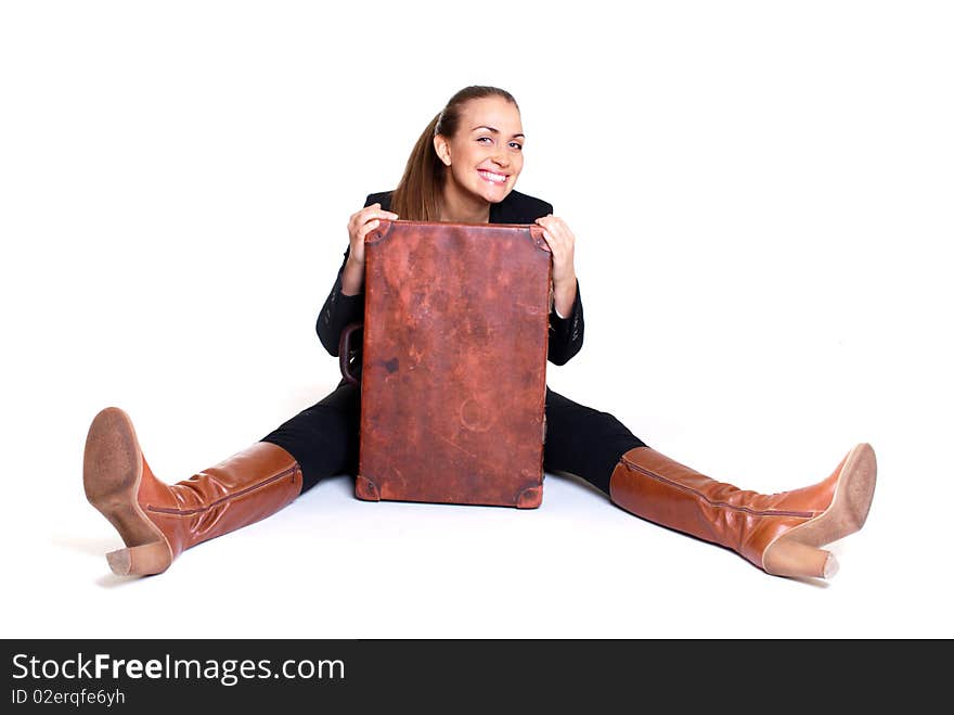 Sitting happy woman with suitcase