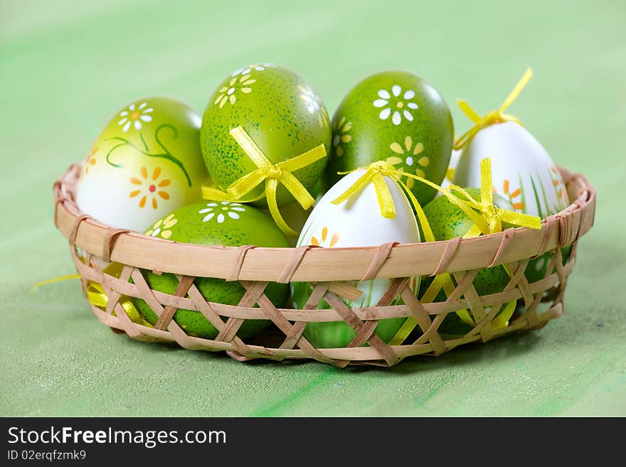 Easter eggs on green background