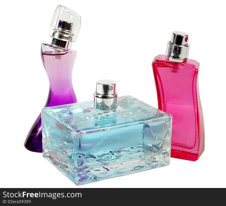 Three glass bottles of female perfume on a white background