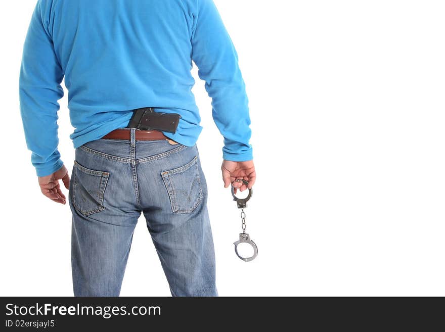 Image of a men with a pistol and handcuffs. Image of a men with a pistol and handcuffs