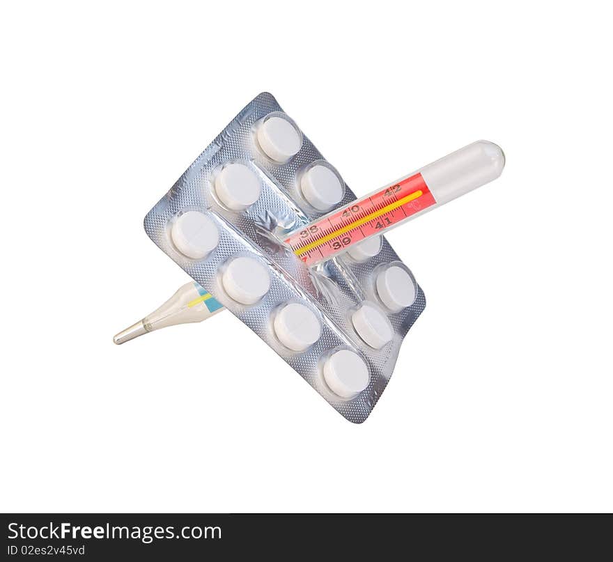 Pack of pills pierced with thermometer isolated on white. Pack of pills pierced with thermometer isolated on white