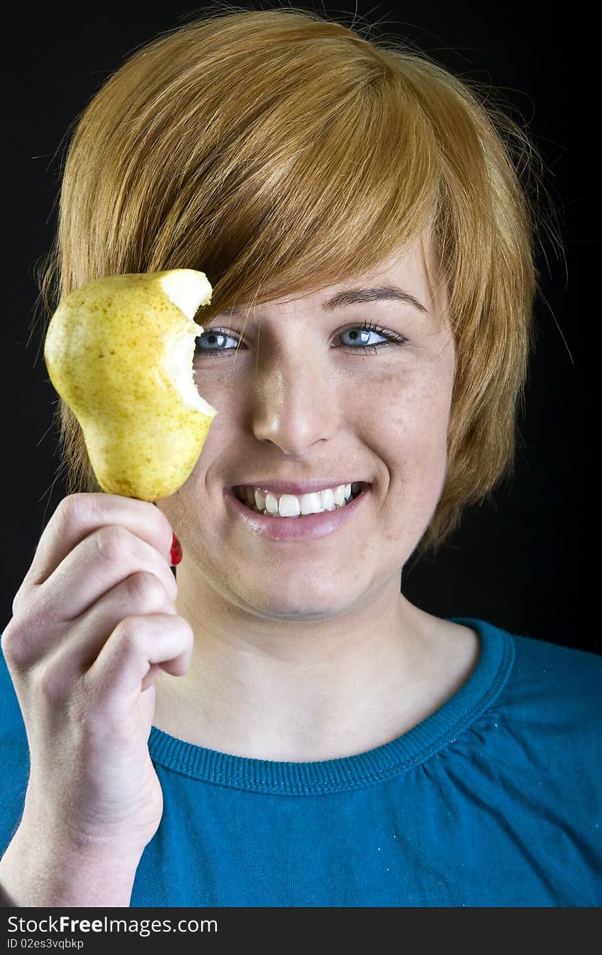 Cute blond girl holding a fruit. Cute blond girl holding a fruit