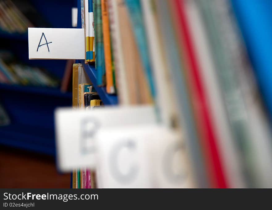 Books on bookshelf in library in a child corner