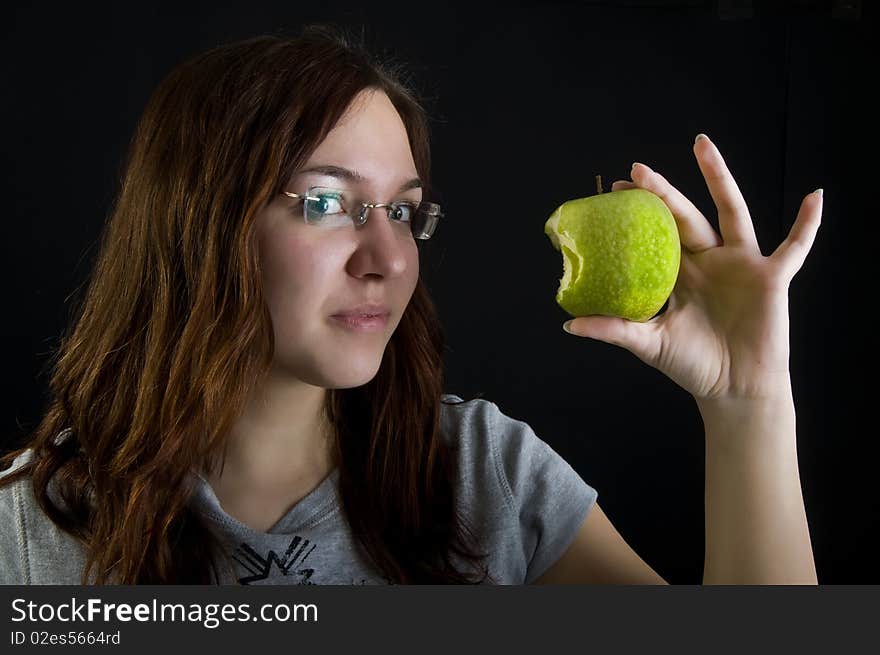 Cute girl holding green apple