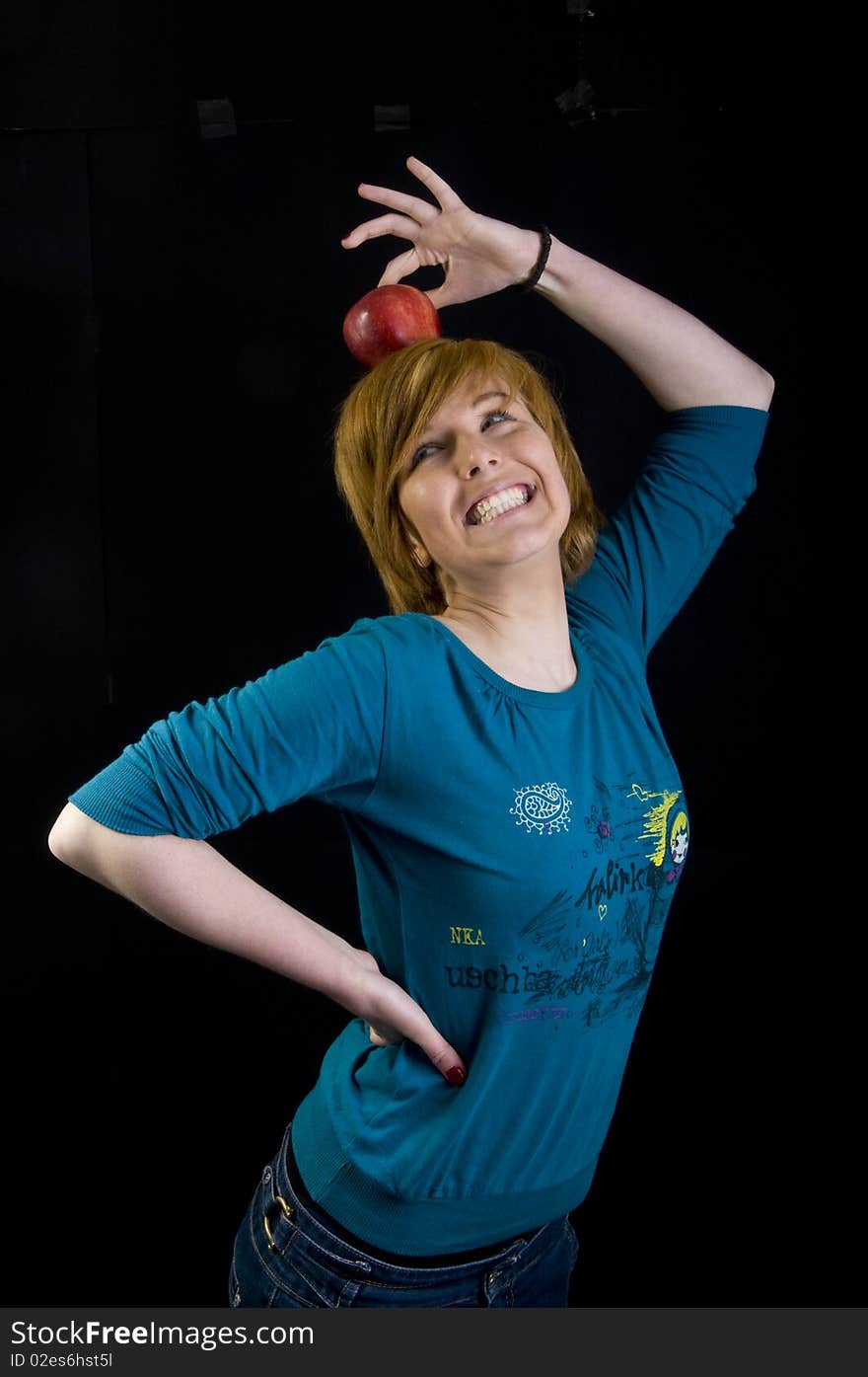 Cute young blond girl posing with her apple. Cute young blond girl posing with her apple