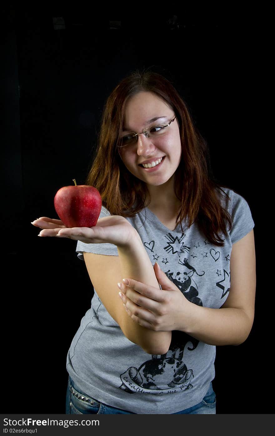 Cute girl holding red apple