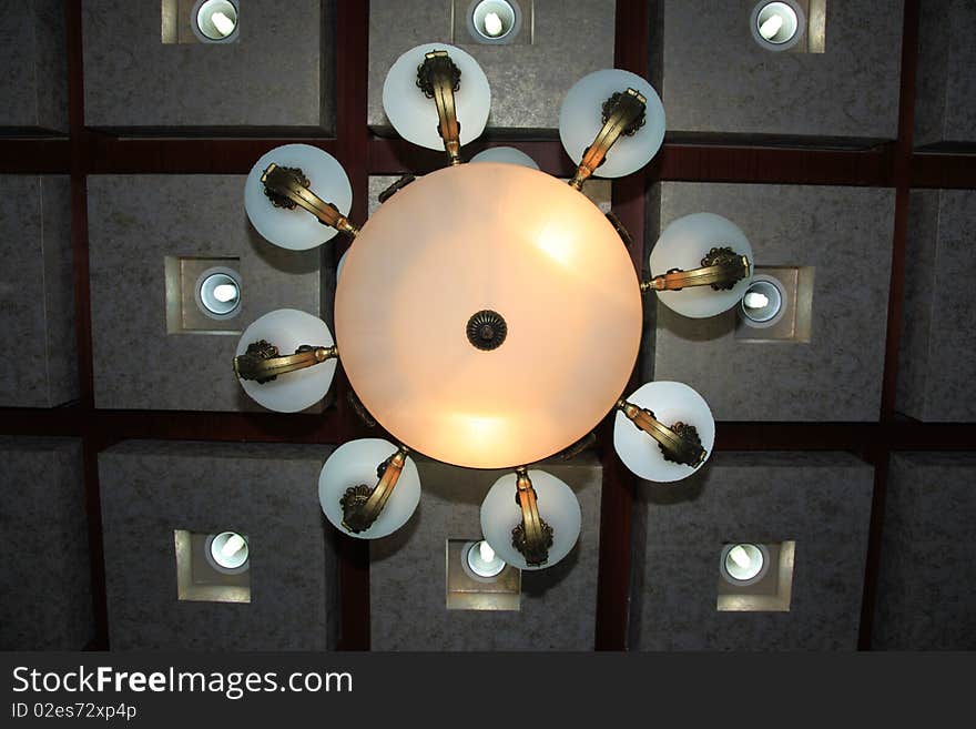 Isolated crystal chandelier in a chinese hotel.