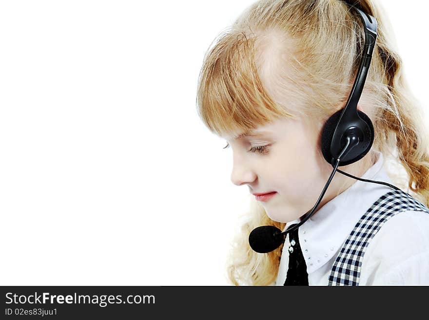 Shot of a little girl in headphones with microphone. Isolated over white background.