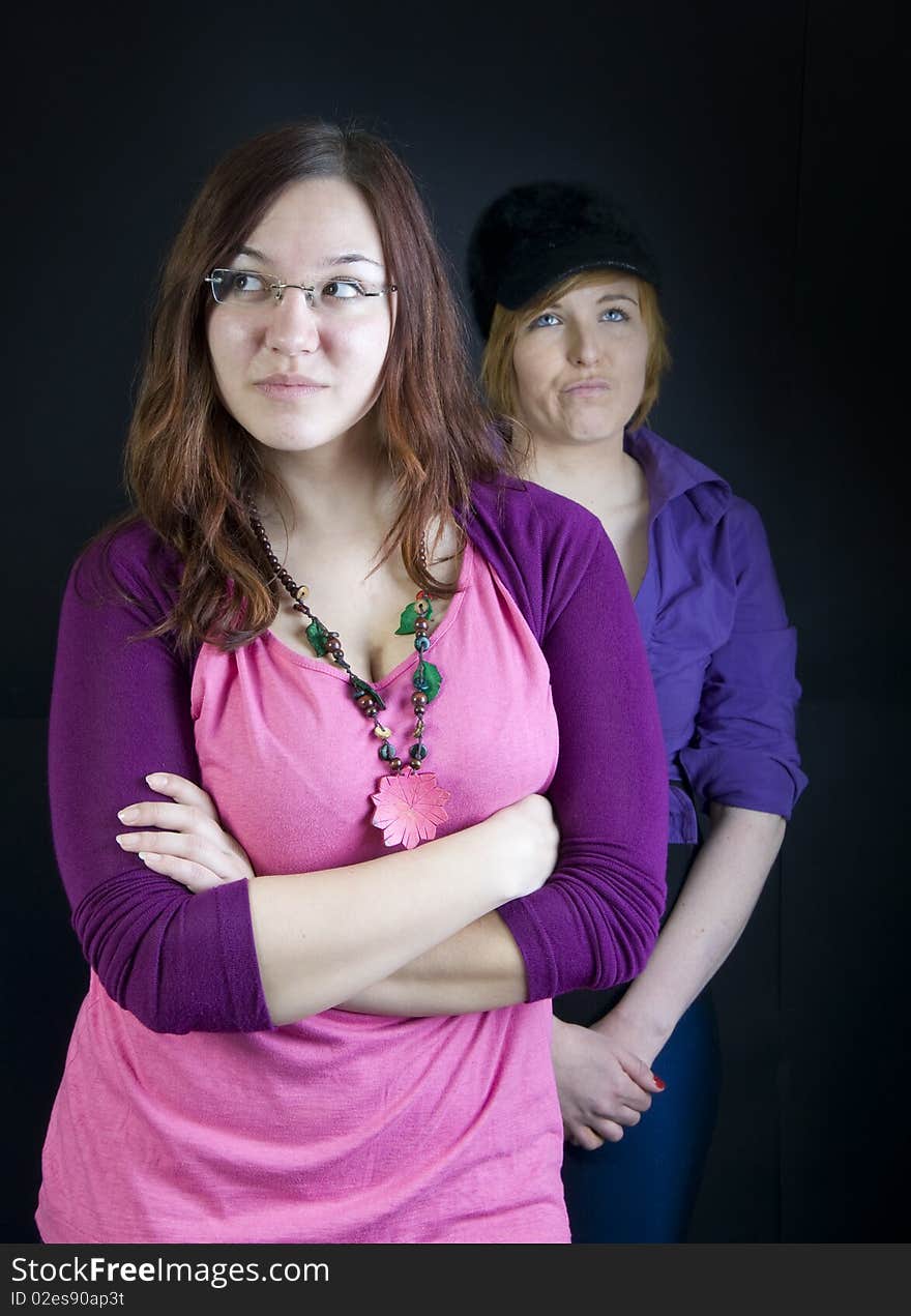 Two girls posing in studio. Two girls posing in studio