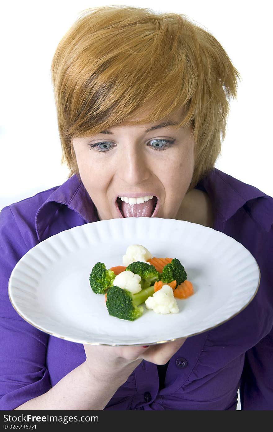 Cute hungry girl holding a plate