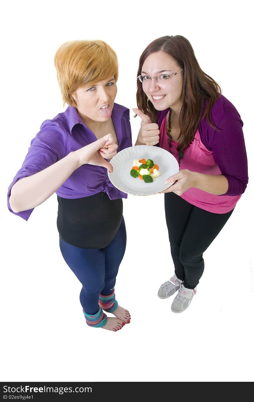 Two cute girls eating healthy food. Two cute girls eating healthy food