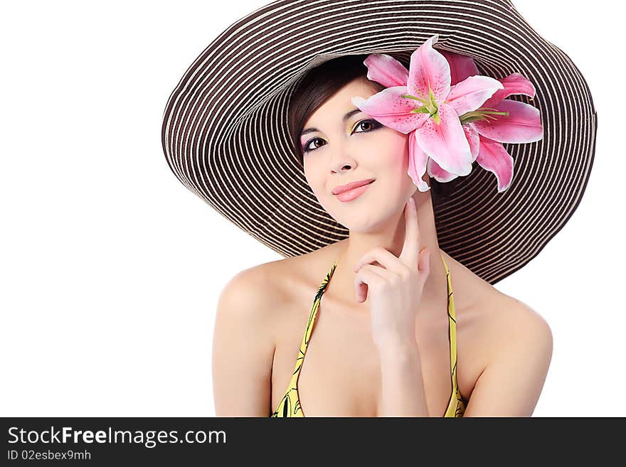 Shot of a young beautiful woman in elegant hat with a lily flowers. Isolated over white background. Shot of a young beautiful woman in elegant hat with a lily flowers. Isolated over white background.