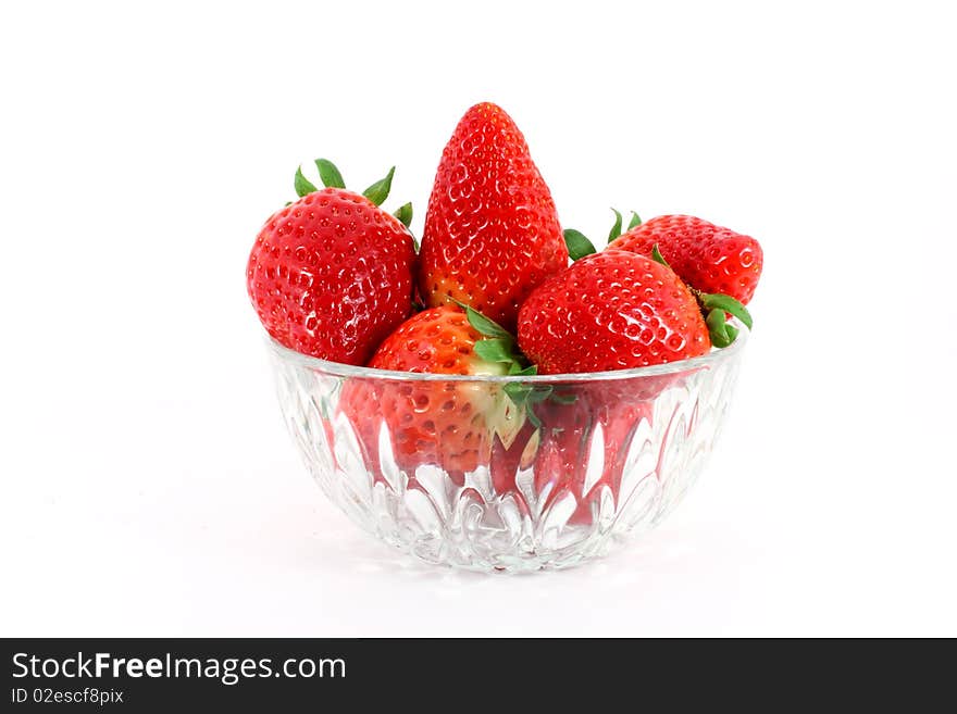 Fresh ripe strawberry in a glass bowl isolated on white background. Fresh ripe strawberry in a glass bowl isolated on white background