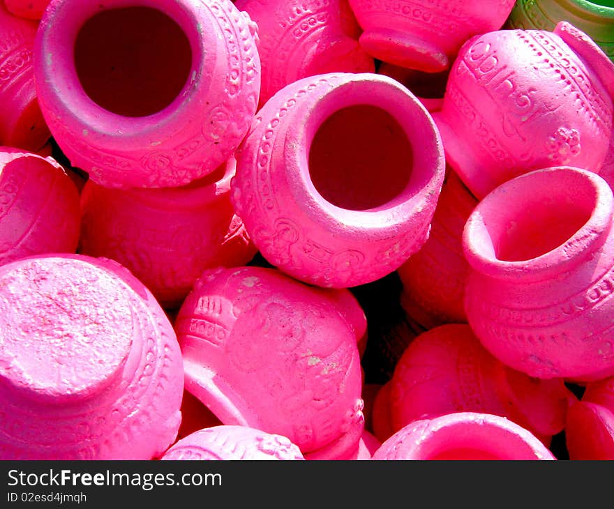 Pink colored clay pots for sale in the market