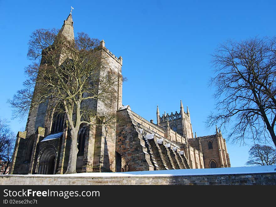 Dunfermline abbey in winter looking majestic compared to the leafless trees around it. Dunfermline abbey in winter looking majestic compared to the leafless trees around it