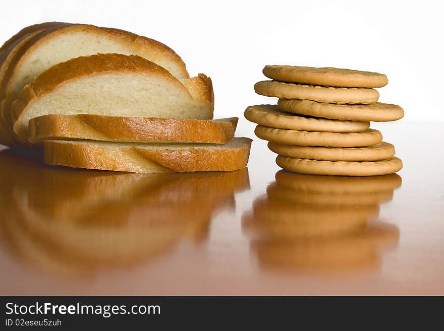 Slice bread and cookies on cook-table. Slice bread and cookies on cook-table