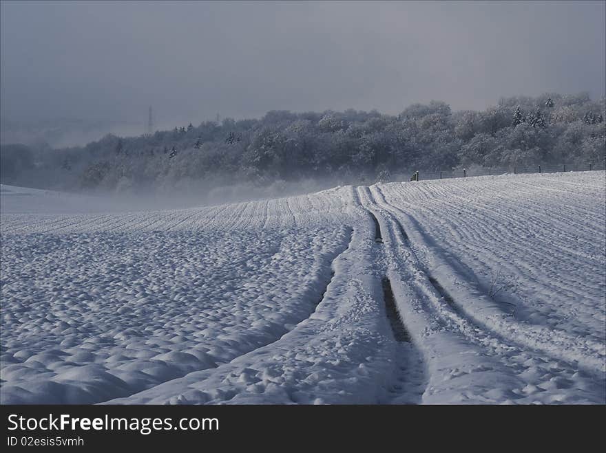 Surreal snow landscape with a road