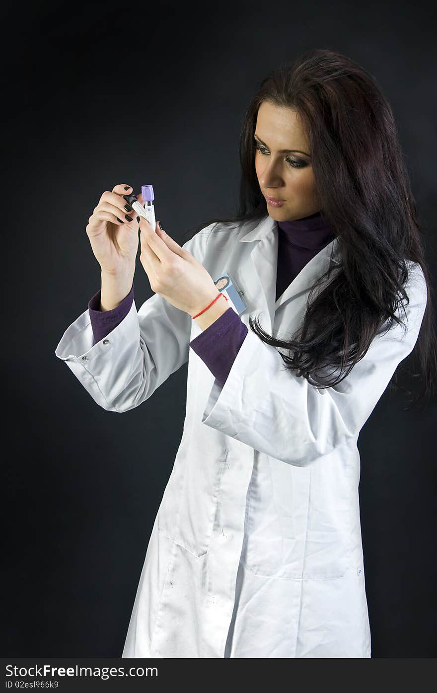 Cute doctor checking  dna sample