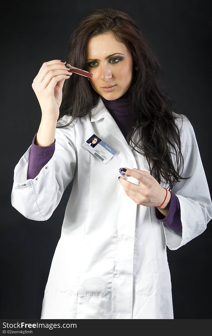 Cute doctor checking blood sample