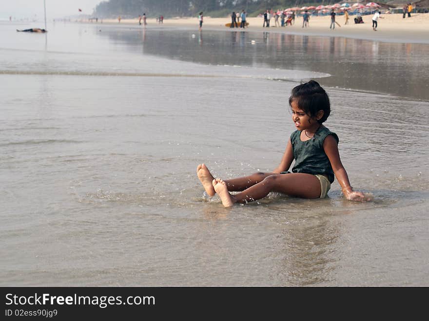 Happy indian girl play games on seacosts. Happy indian girl play games on seacosts