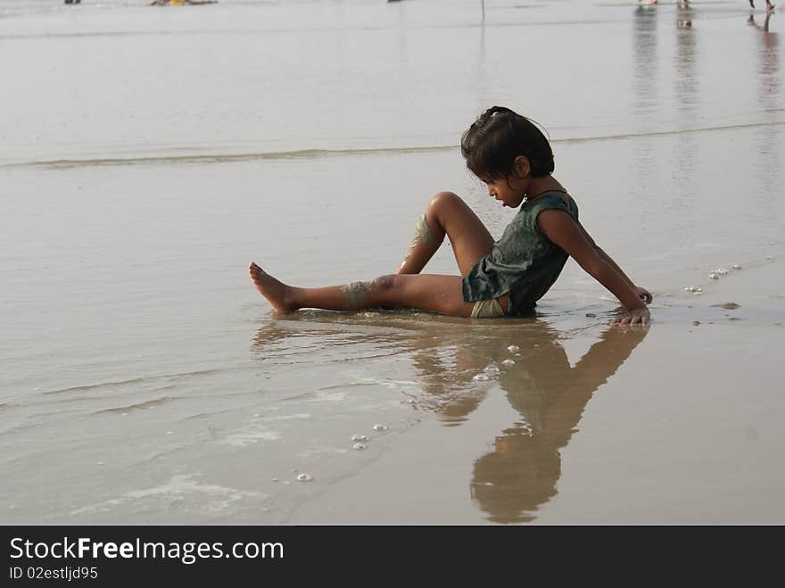 Happy indian girl play games on seacosts. Happy indian girl play games on seacosts