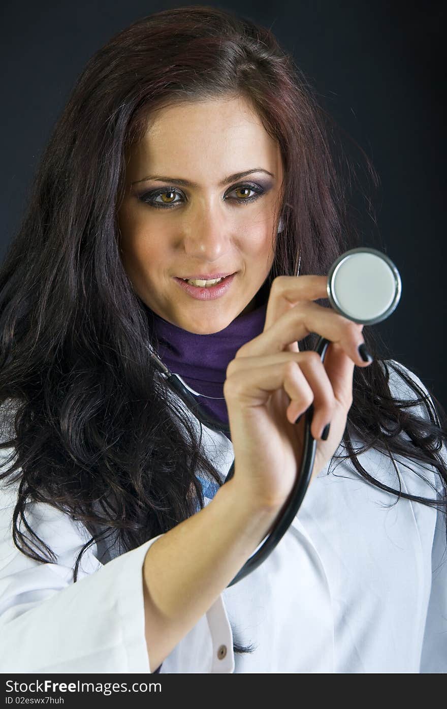 Cute female doctor holding a stethoscope