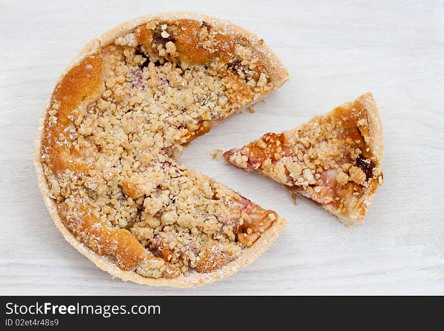 Freshly baked rhubarb crumble on a wooden board