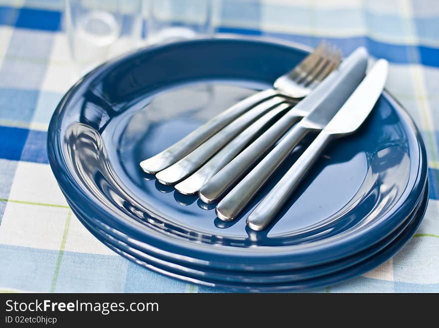 Stack of blue dishware and tableware