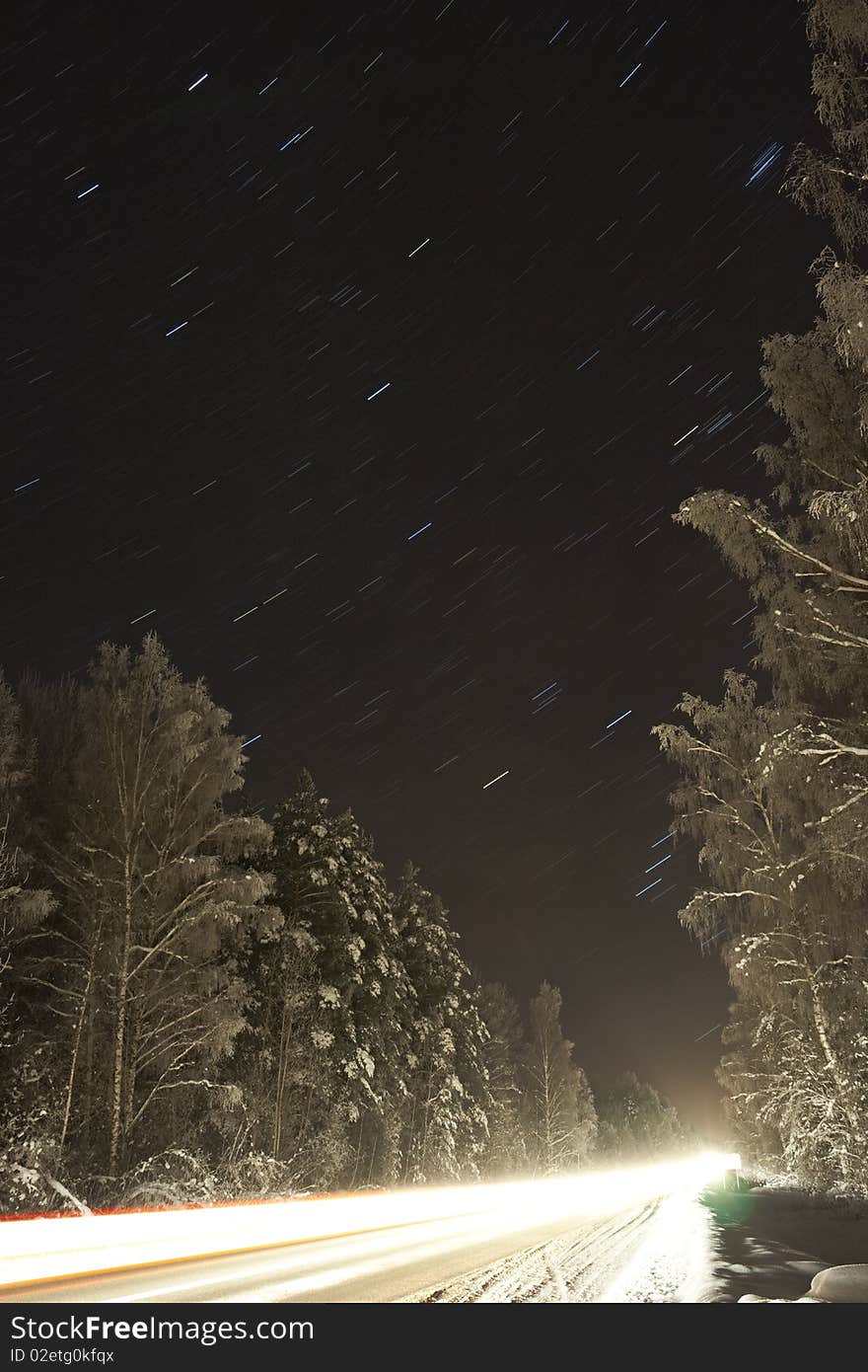 Long exposure of a road with star and light trails. Long exposure of a road with star and light trails