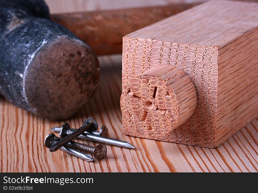 Wooden board with a cylindrical ledge for fastening with other surface.