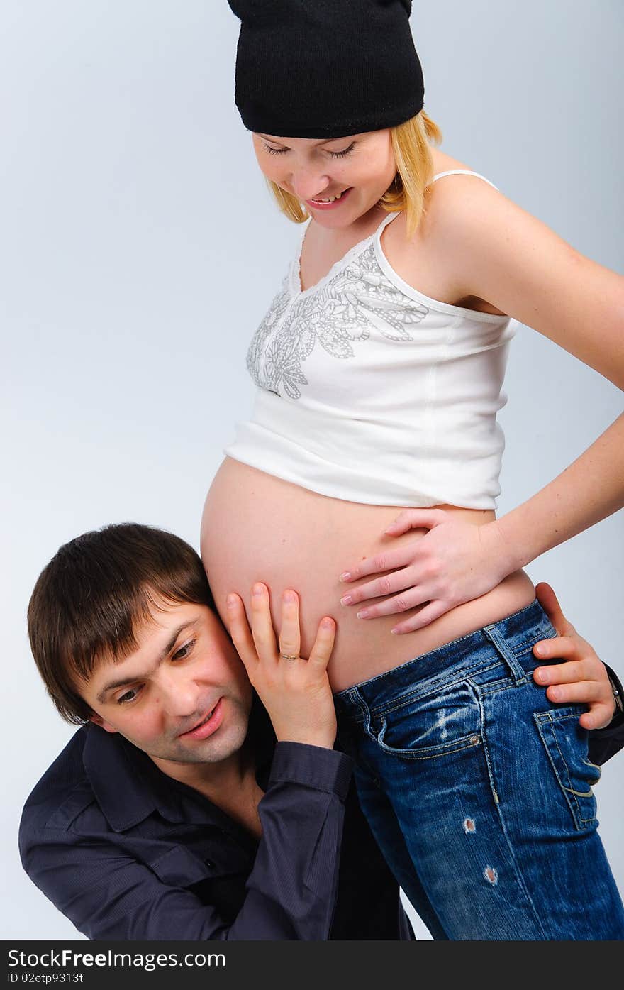 Portrait happy young couple in studio