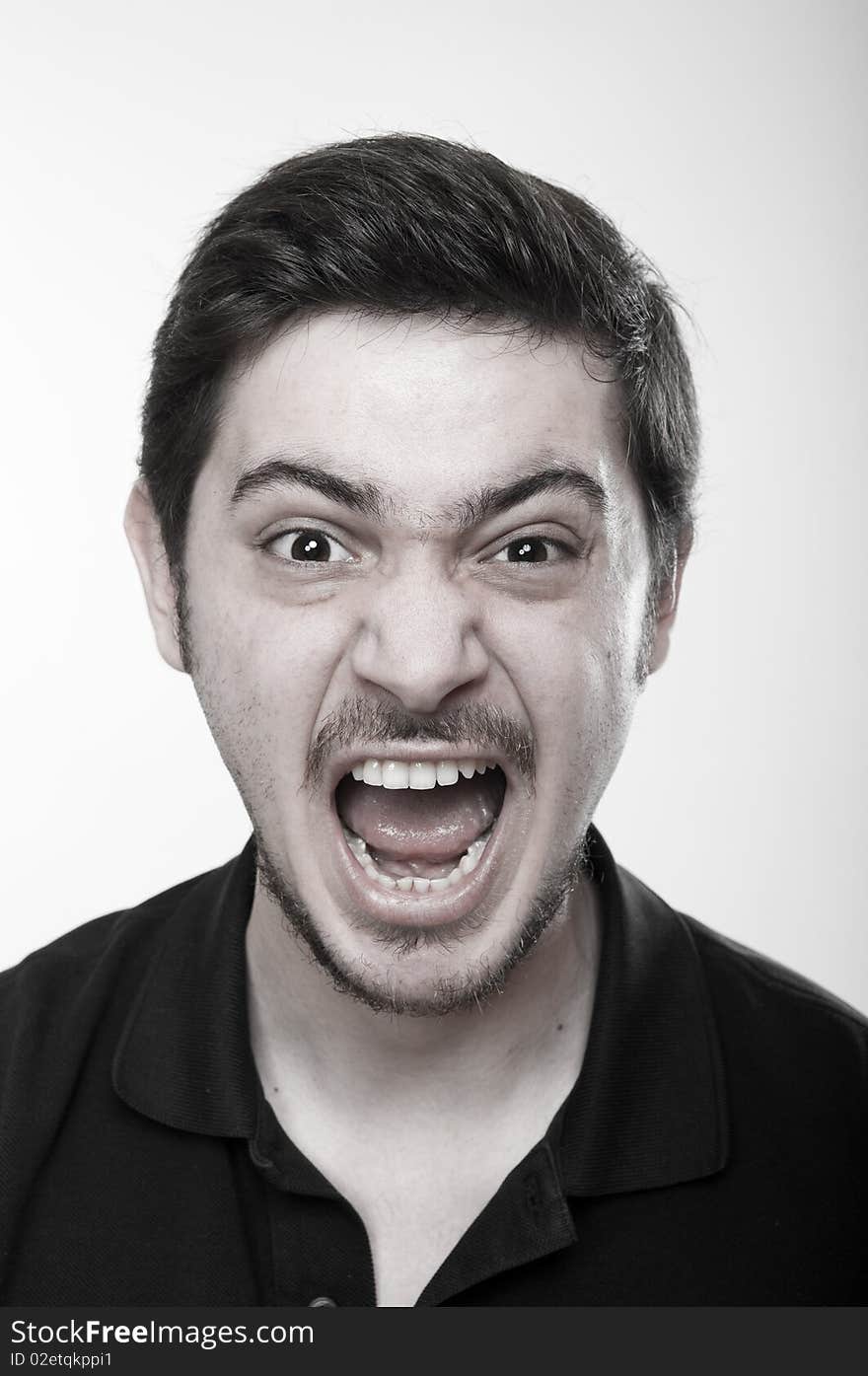 Portrait of an angry man screaming. Portrait of an angry man screaming.