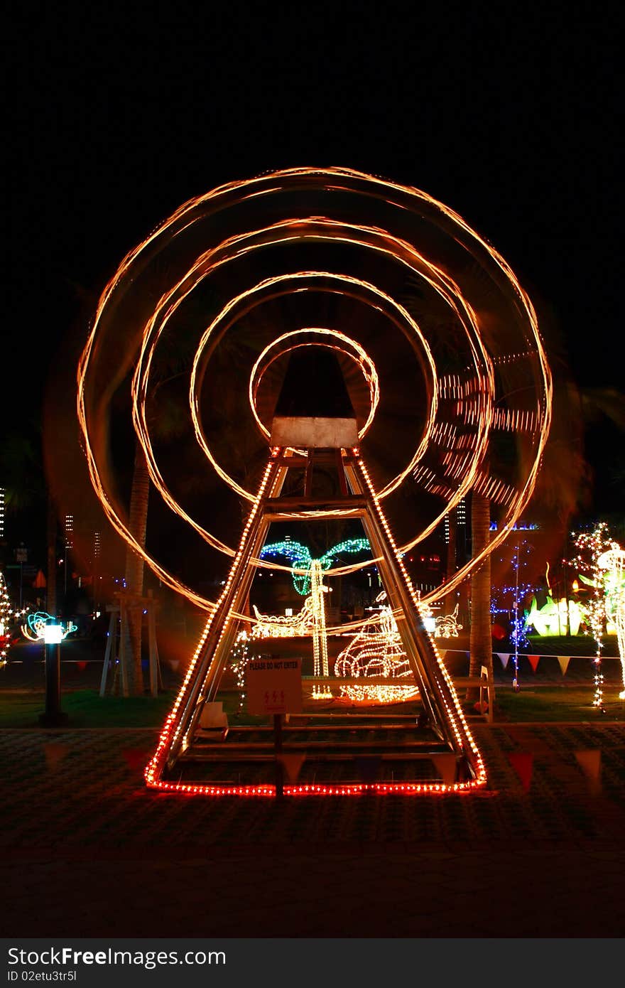 Wheel illuminated at night in funfair park. Wheel illuminated at night in funfair park