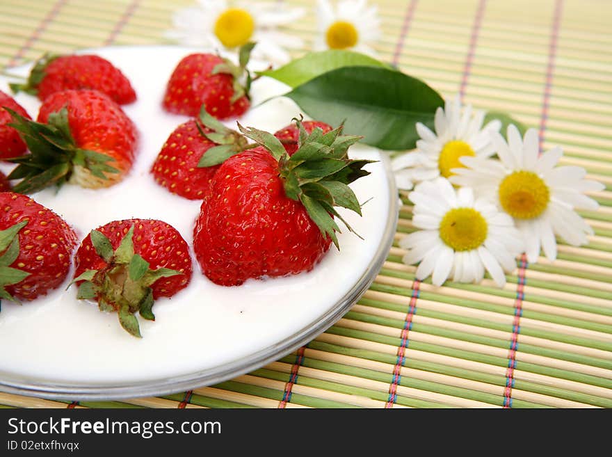 Ripe berries in milk