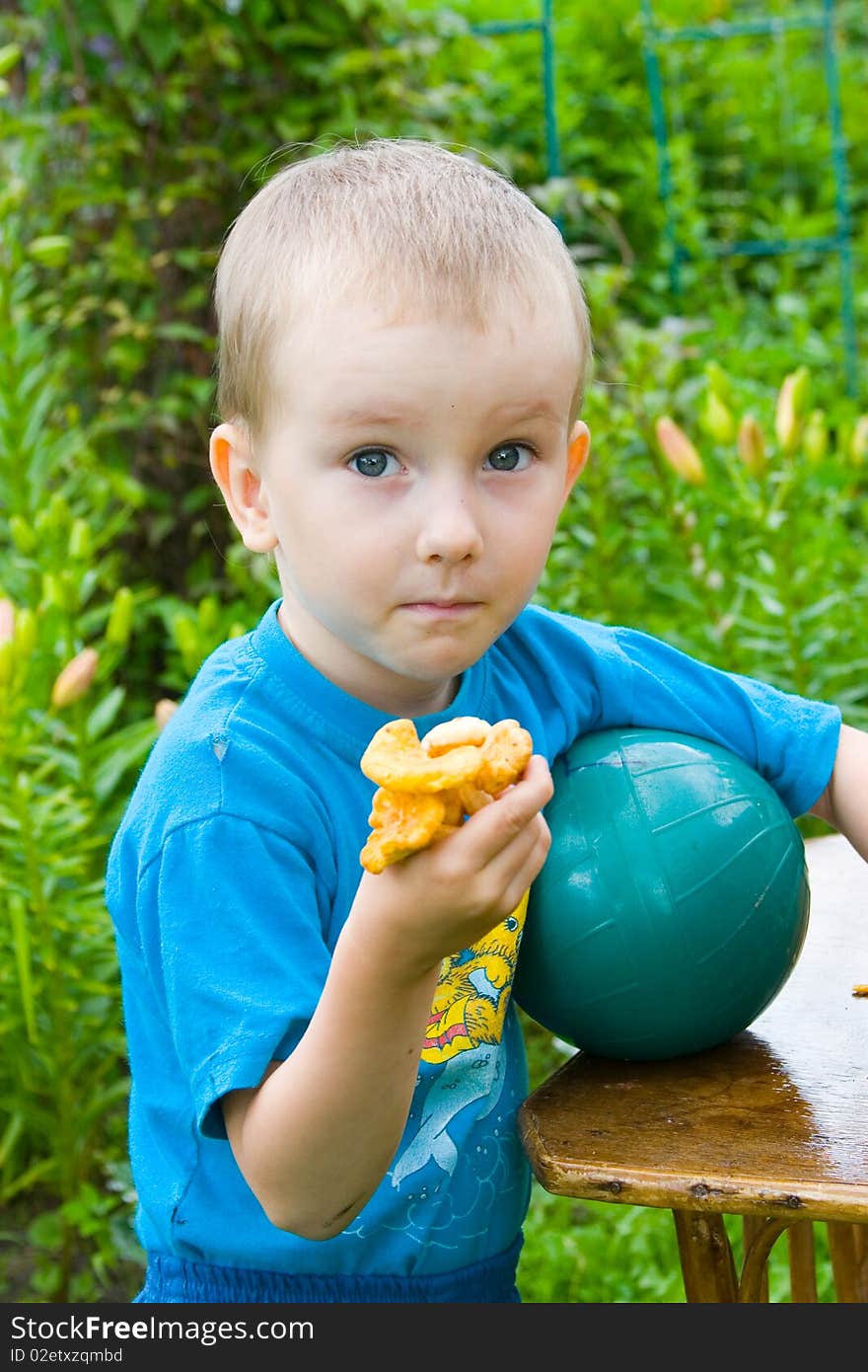 Boy with mushrooms outdoors in the summer