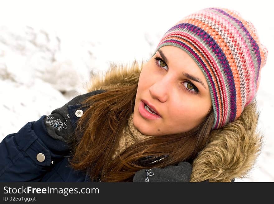 Portrait of young woman in colored cap. Portrait of young woman in colored cap