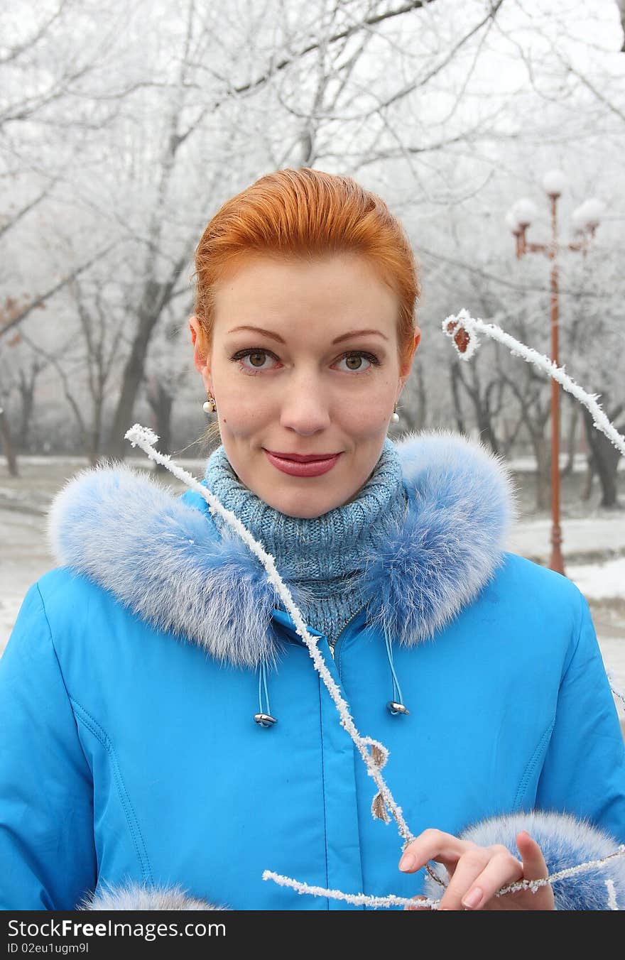 The red-haired girl against the frozen park. The red-haired girl against the frozen park