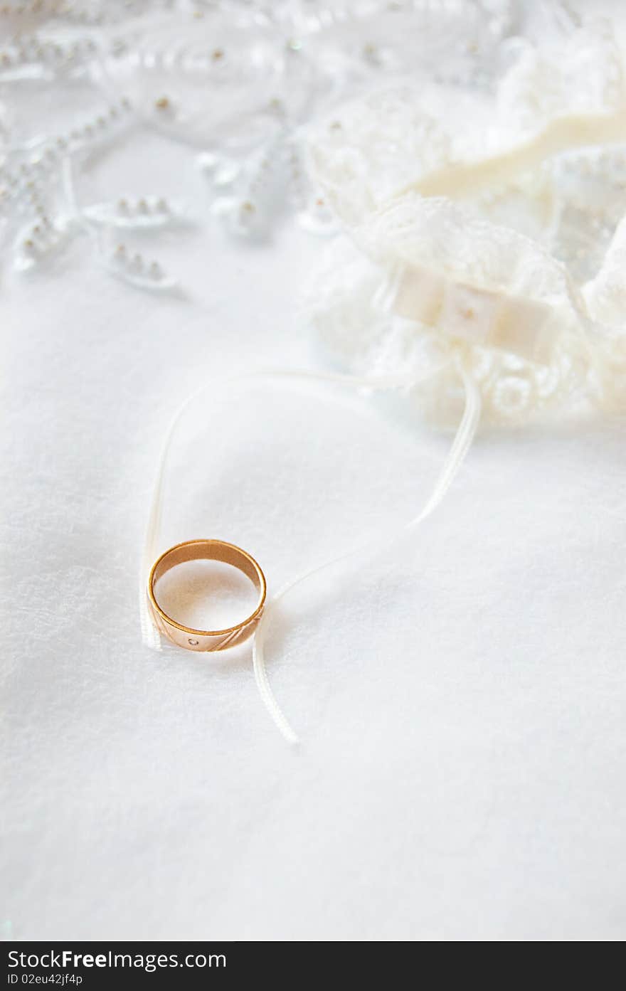 Wedding ring on satin and lace. Wedding ring on satin and lace