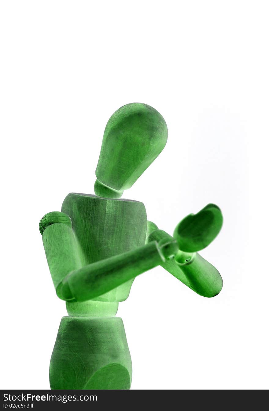 A green wooden manikin on white background