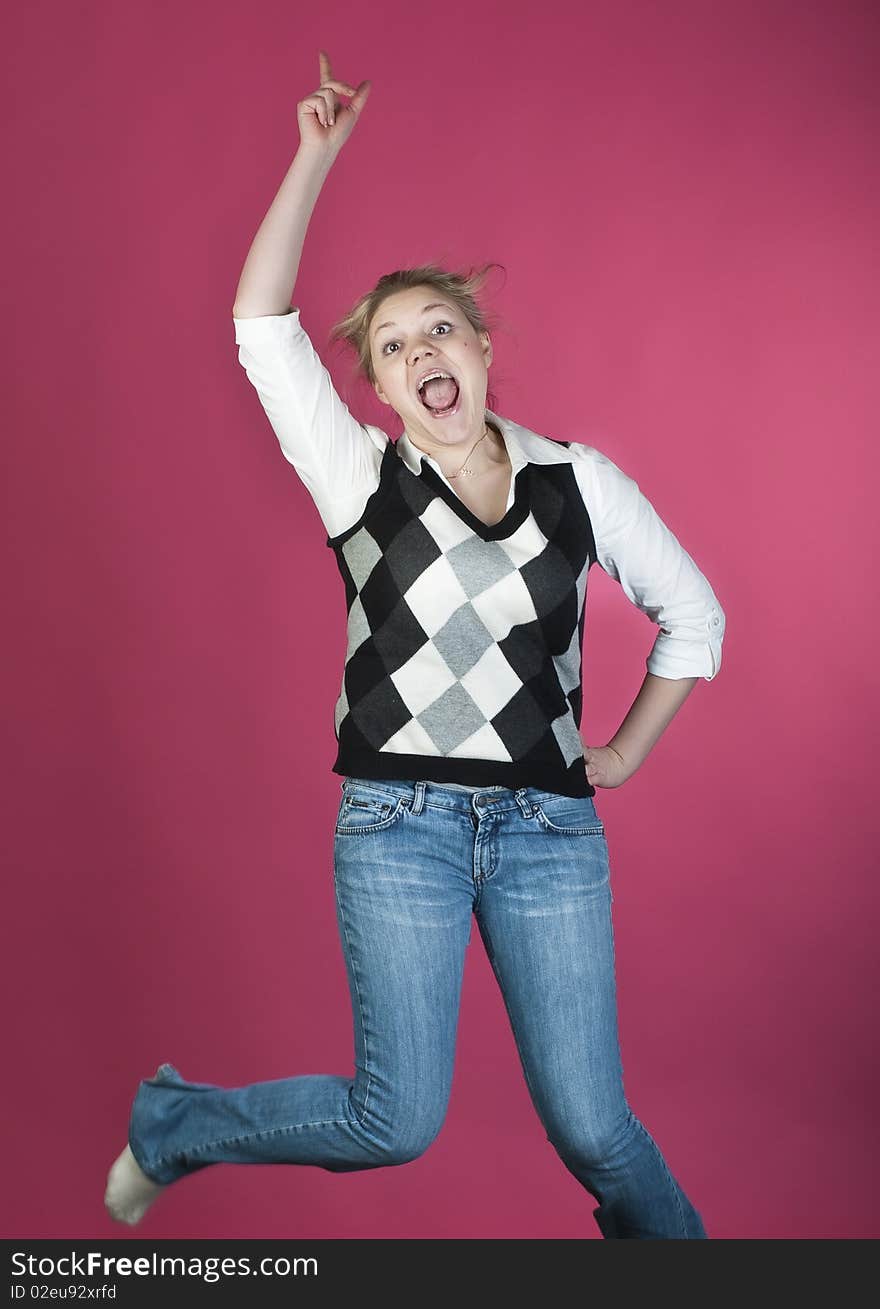 Woman with blond long hair and happy smiling facial expression jumping up. Woman with blond long hair and happy smiling facial expression jumping up