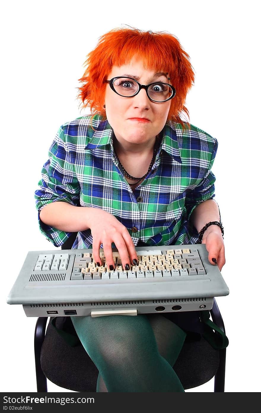 Girl with an old keyboard on a white background