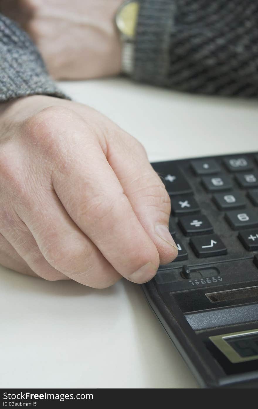 Workman`s Hands And A Calculator.