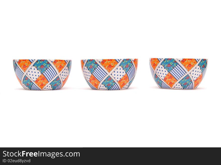 Row of three porcelain bowls isolated on white background