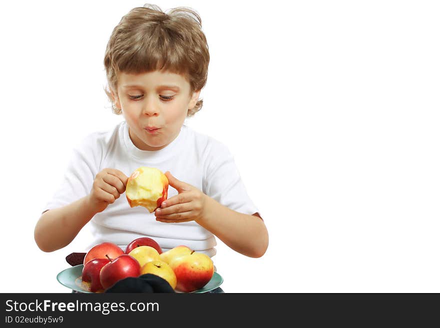 Little beautiful child playing and eating an apple - isolated on white. Little beautiful child playing and eating an apple - isolated on white